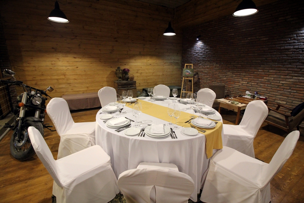 Private dining — round table with covered chairs